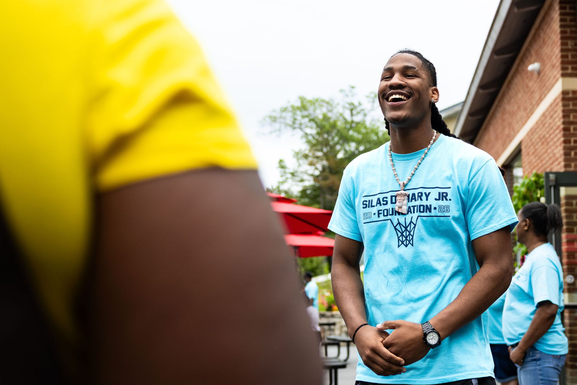 Silas Demary Jr. with young fans at a foundation community event