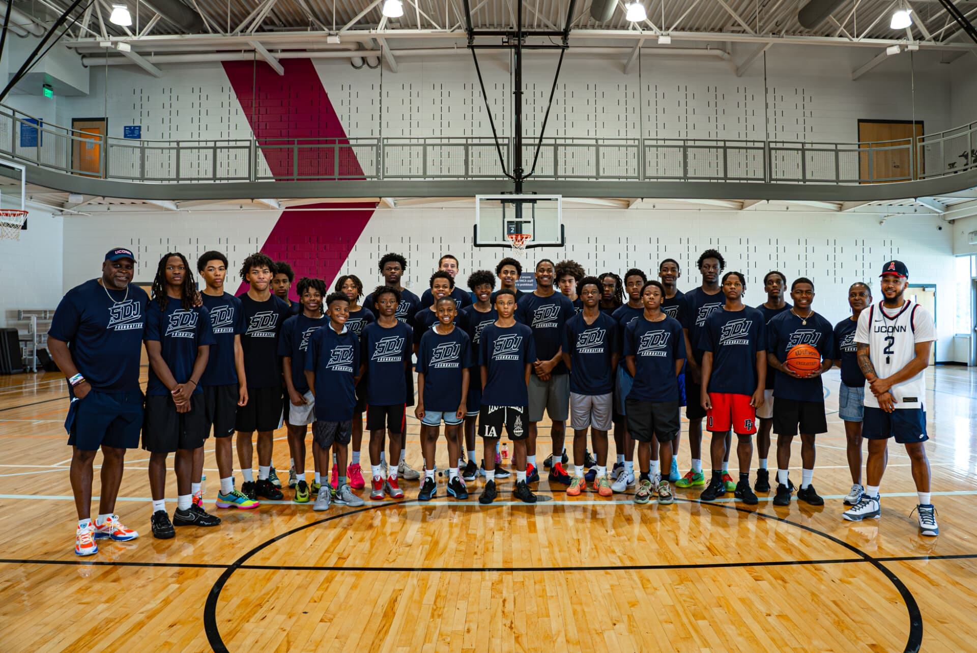 Foundation basketball camp team lined up in a gym